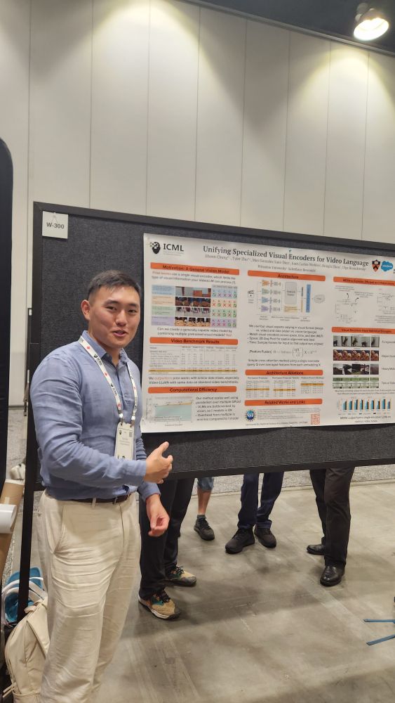 researcher presenting poster at ICML
