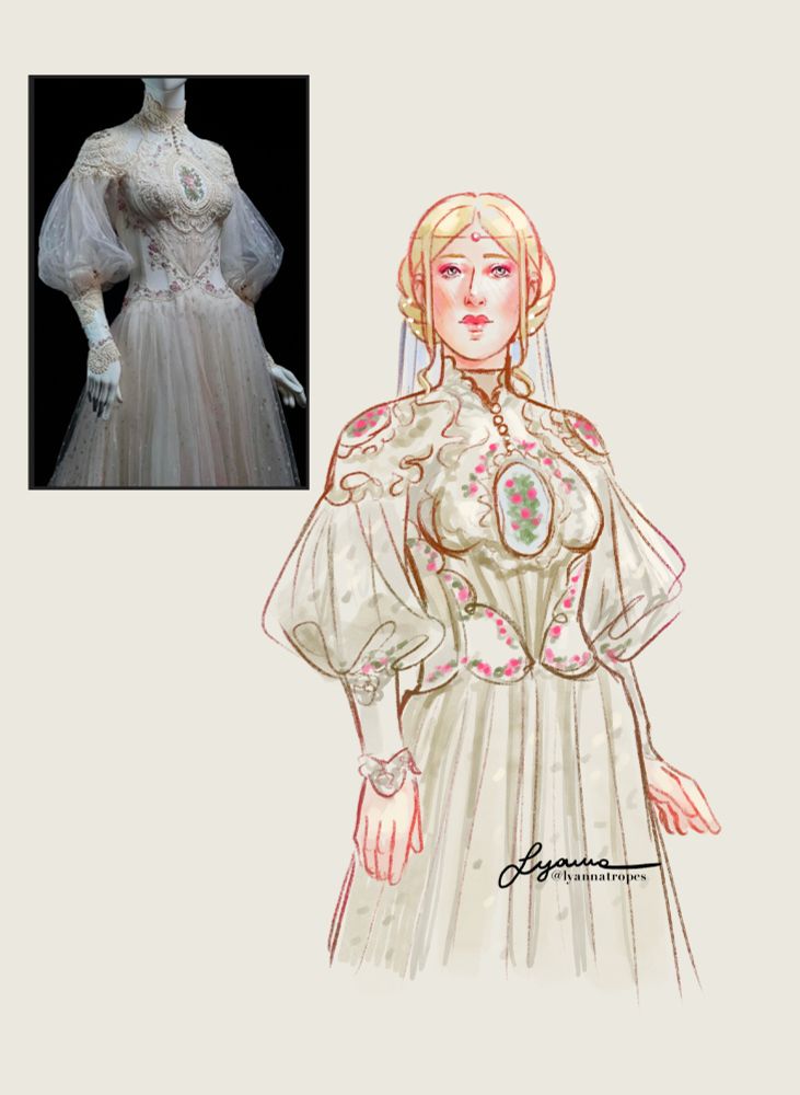 Camellia wearing a grown embellshed with lace over the bodice. Small roses are embroidered in the center piece, on the shoulder pieces, and alongside the lace borders. The sleeves and skirt are made of a material that looks like organza. 