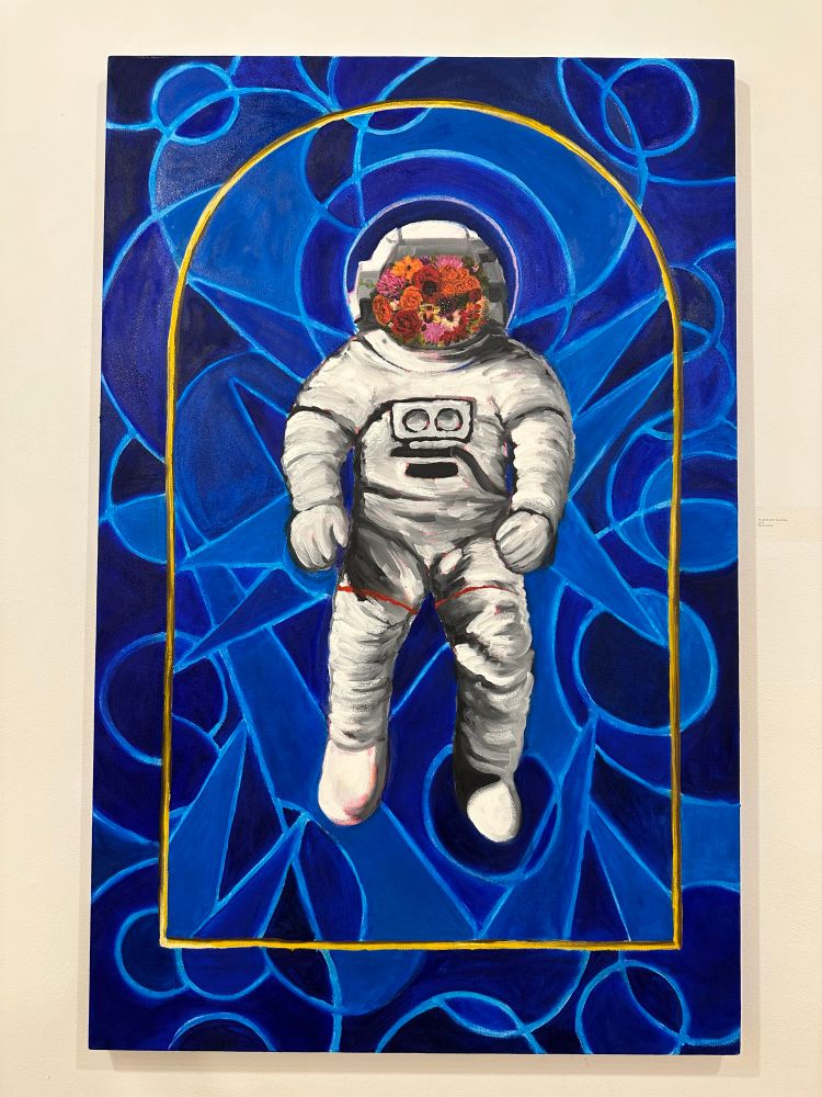An oil painting of an astronaut with a blooming face plate floating on an abstract field of blue inside a gold frame