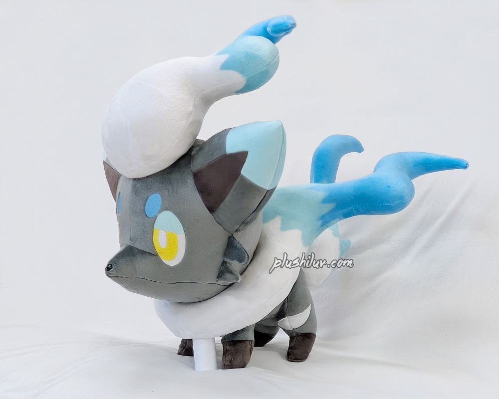 photo of a hand made shiny Hisuian Zorua plush on a white background