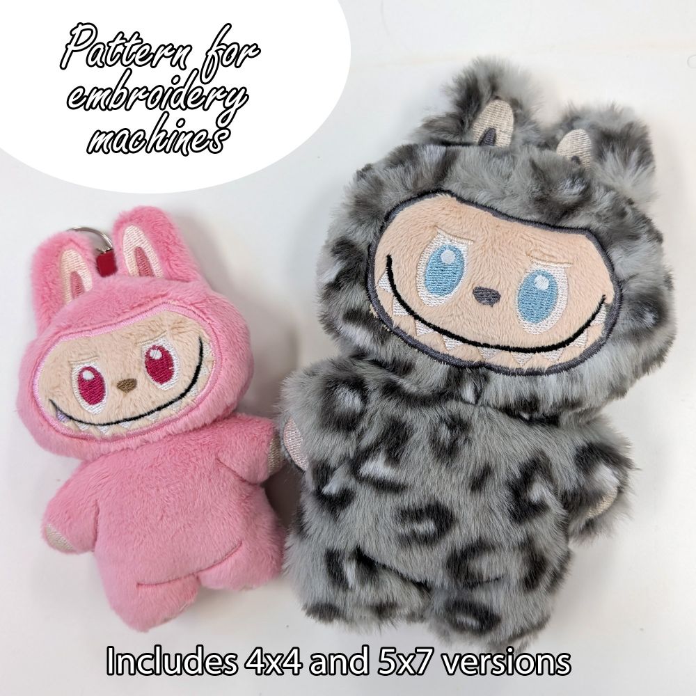 Photo of two handmade Labubu plushies. The smaller one is pink and made with short minky while the larger one is made with snow leopard print faux fur. 