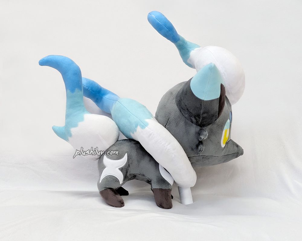 photo of a hand made shiny Hisuian Zorua plush on a white background