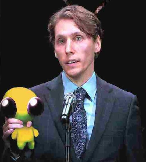photo of jerma985 with flug edited in, being held by the neck (not safe!)