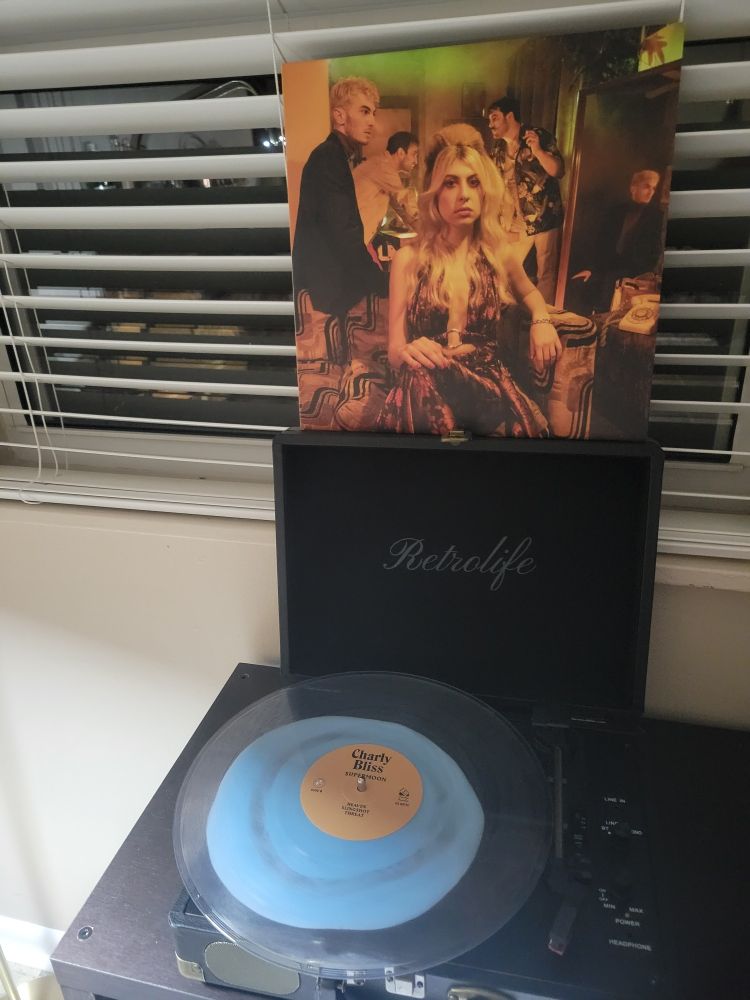 The album Supermoon from the band Charly Bliss on a record player.