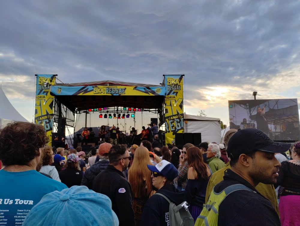 Stage with Ska and Reggae festival decoration with a crowd in front 