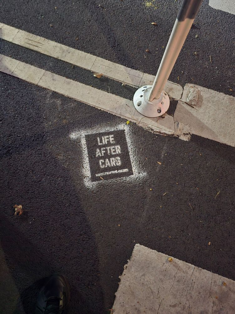 A stencil painted on the ground in Clinton Hill for "Life After Cars", their new book (which is excellent, I'm halfway through and recommend it)
