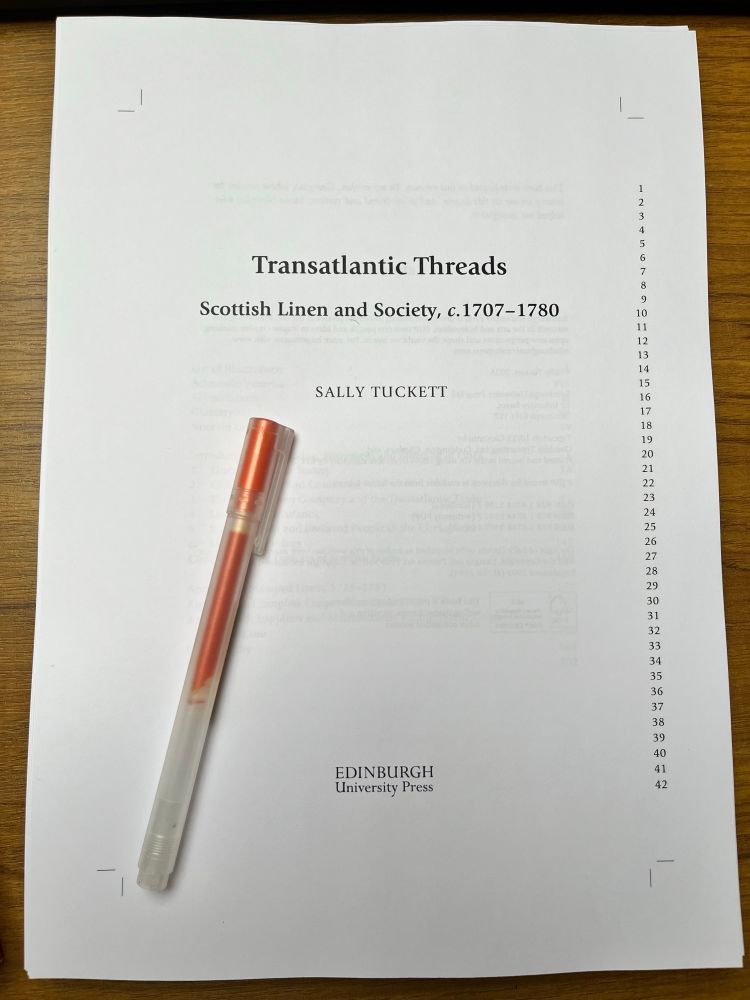 Typescript of front part of book titled ‘Transatlantic Threads: Scottish Linen and Society, c1707-1780’ with a pen laid on top.
