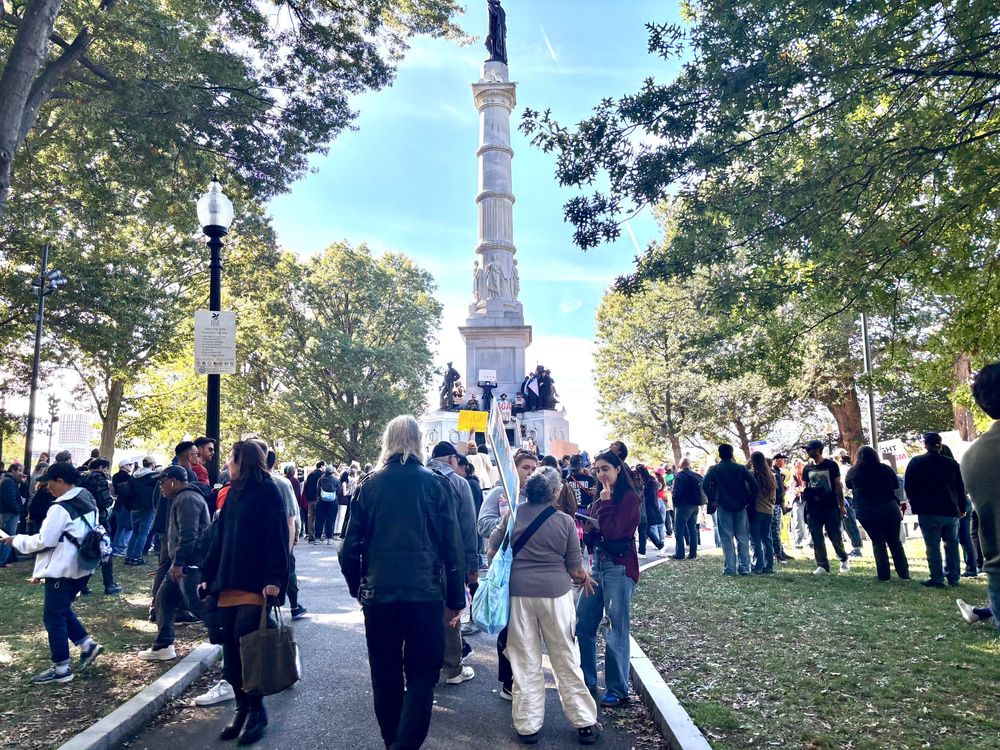 Photo of protestors gathered at the Soldiers & Sailors monument, at the "No Kings" rally in Boston Common