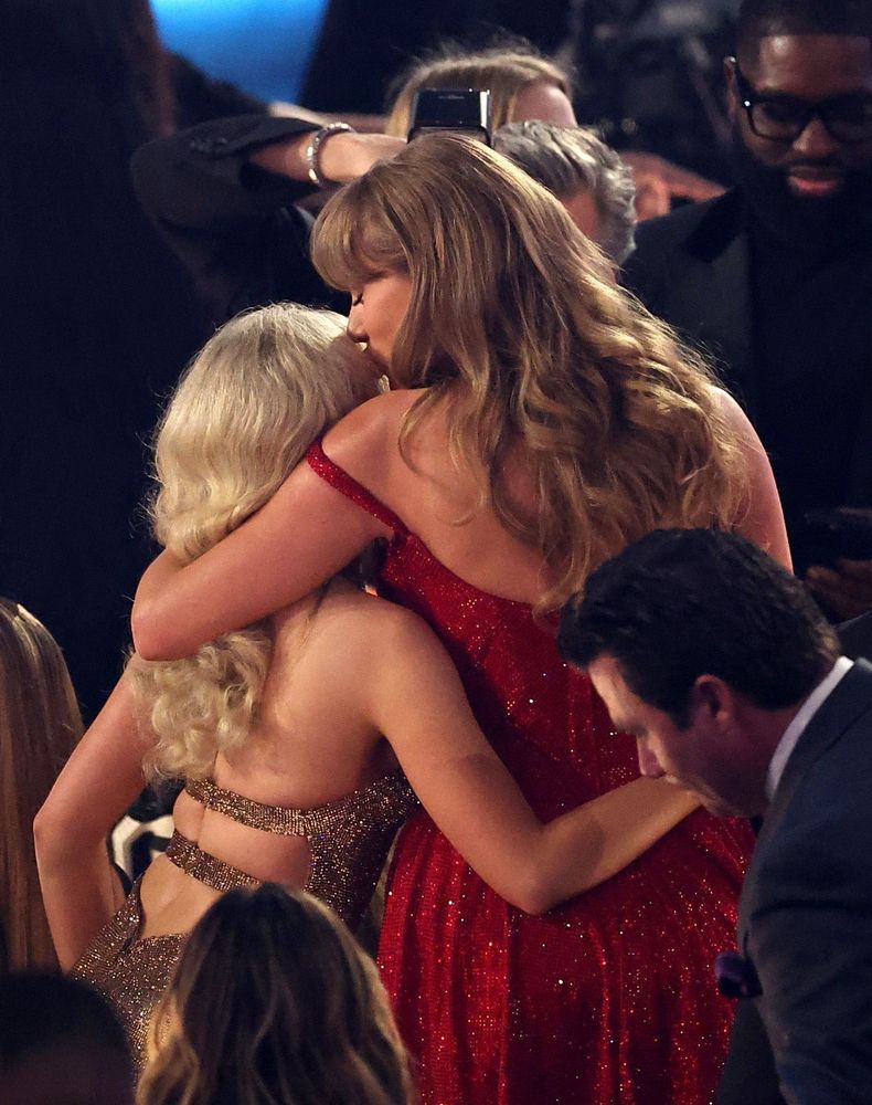 Taylor Swift giving Sabrina Carpenter a lil head kiss 