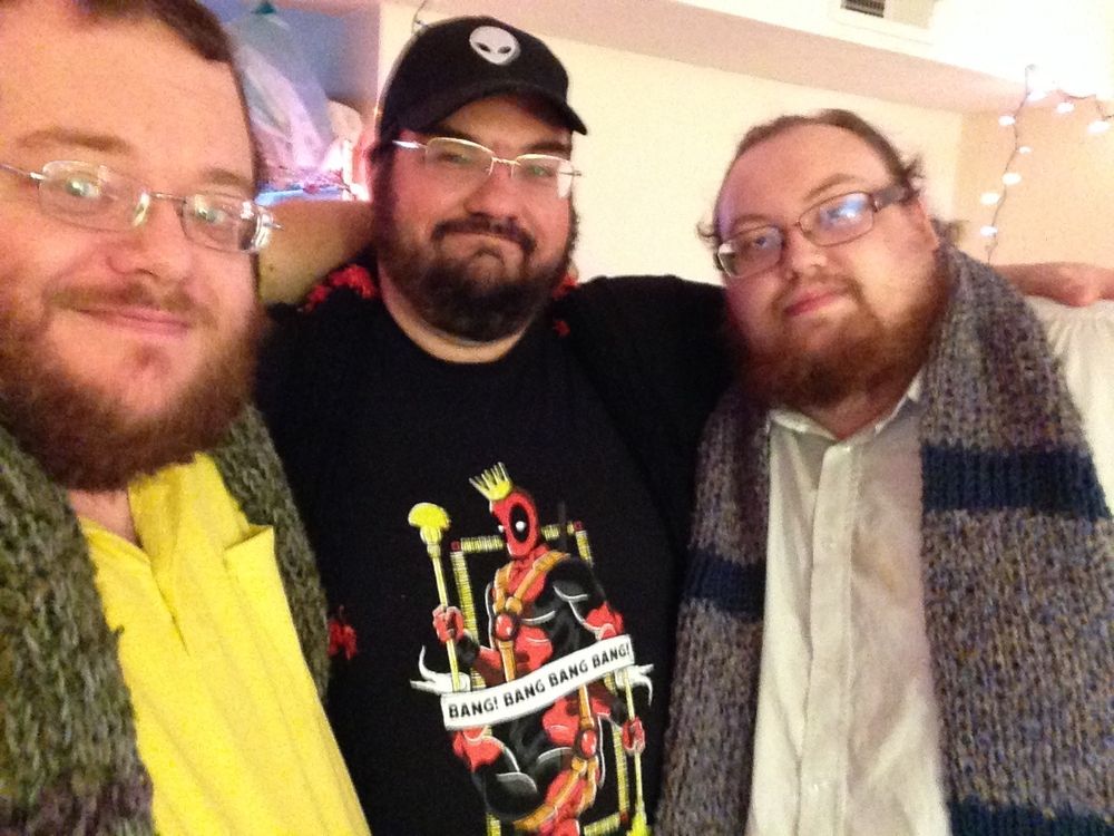 Selfie of 3 bearish men with their arms over each others’ shoulders