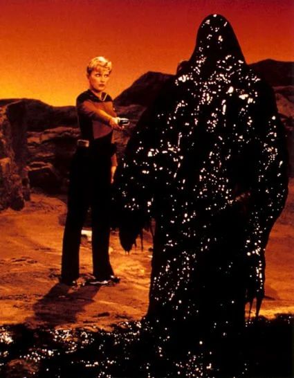 Gerald sleeping in bed has the same geology and color tone as TNG's Varga II