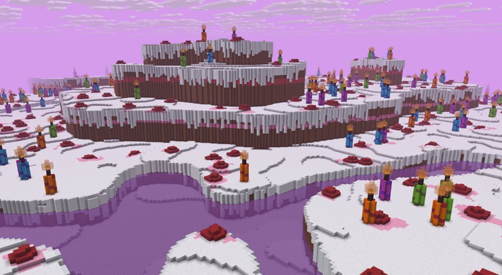 A screenshot of a Minecraft world that looks like a cake. It consists of 4 layers. Each layer has frosting on the top and brown cake below. There are a lot of candles on the cake. In the foreground, there is a pink "river".
The sky is pink with the normal white Minecraft clouds.