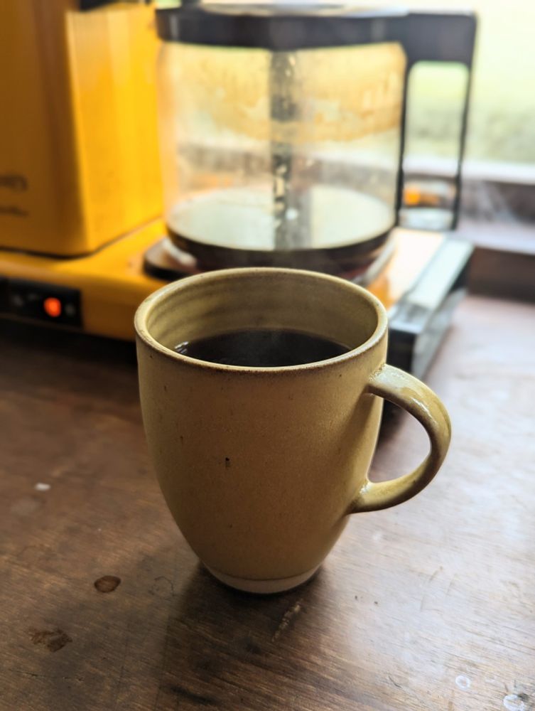 yellow mug with coffee