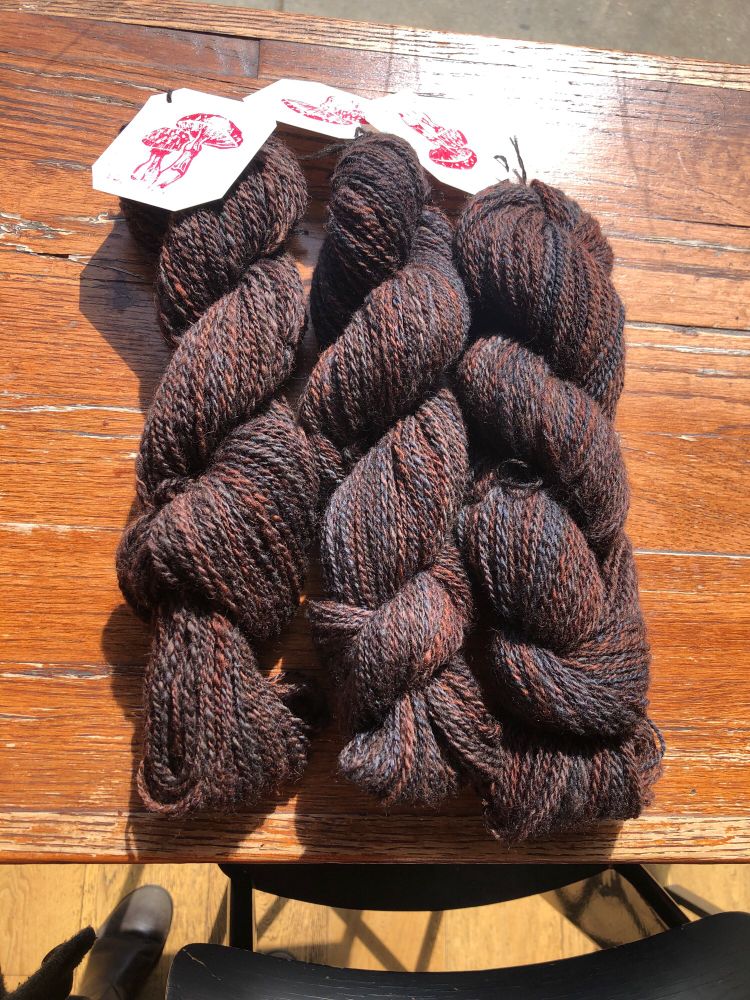 Three skeins of brown yarn