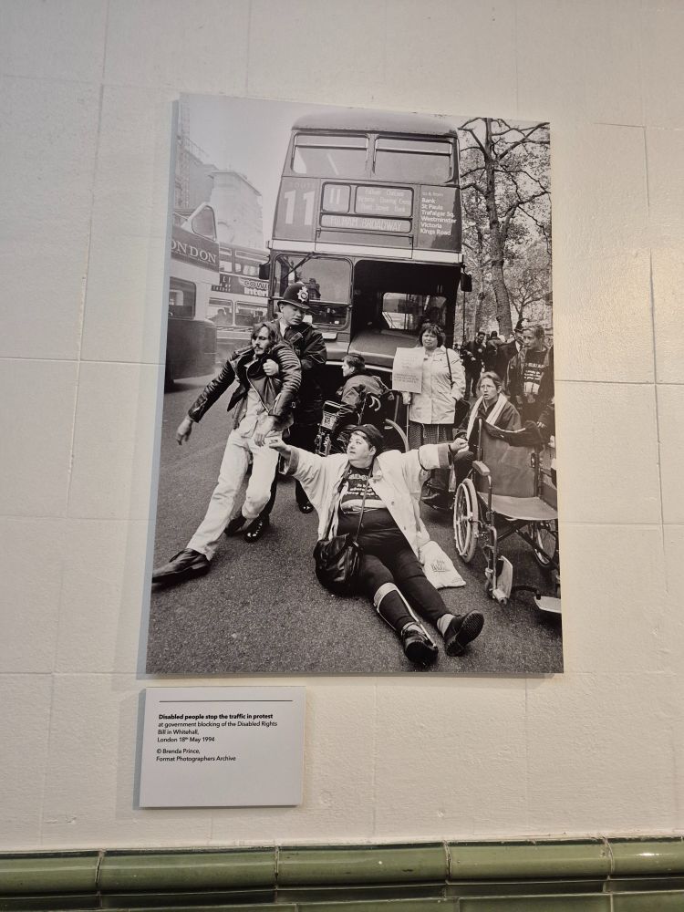 Photo of a photo of disabled people stop traffic in a protest 
