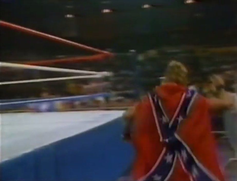Dick Slater wearing a rebel flag jacket to the ring on an episode of WWF Wrestling Challenge from 1986