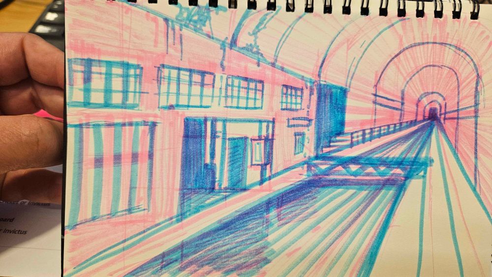 large tunnel with a canal outside of a warehouse