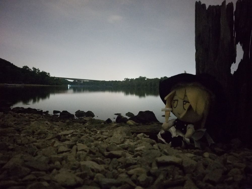 marisa kirisame fumo sitting on the rocky lakeshore in the middle of the night