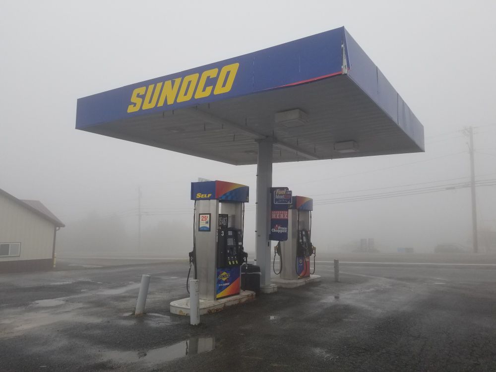 empty sunco gas pump surrounded by dense fog