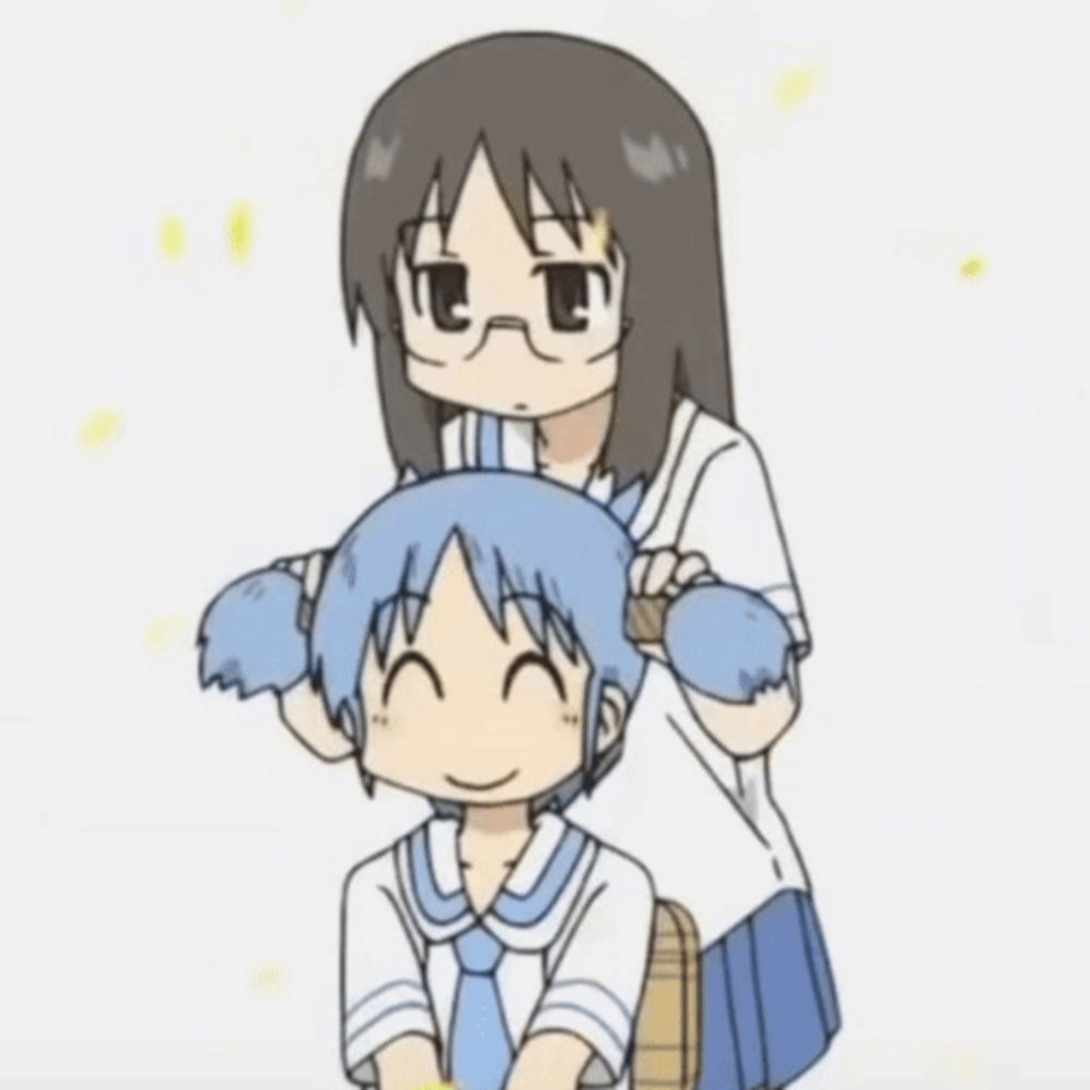 a girl with glasses is brushing another girl 's head