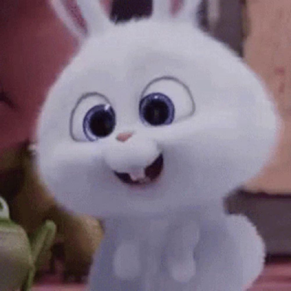 a white rabbit from the secret life of pets is smiling .