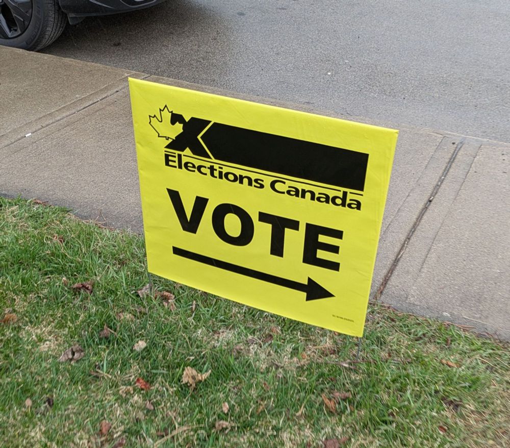 A yellow Elections Canada sign that says "vote"