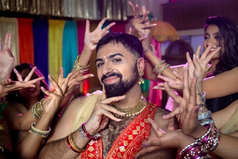 Vinay dressed in cultural clothing while posing.