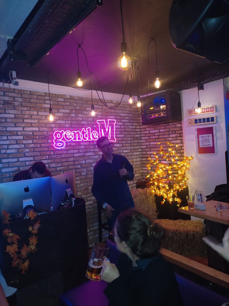 Keynote speaker Noah Riseman singing Rasputin