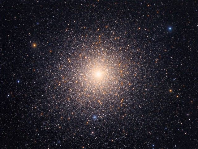 This large and bright globular star cluster is the 2nd brightest as seen from Earth, only surpassed by the massive Omega Centauri. Both clusters are Southern Hemisphere objects and are easily visible with the naked eye.
Of the two I personally consider 47 Tucanae to the be most impressive because of its extremely dense and bright core region which is a spectacle to behold, both visually through the eyepiece and photographically as in this image.

47 Tucanae is located around 17,000 light years away in the direction of the Southern constellation Tucana (The Toucan) and  appears very close to the Small Magellanic Cloud, one of the two prominent satellite galaxies of the Milky Way.
The cluster spans an angular diameter larger than the full Moon and is one of the most massive globular clusters, home to millions of individual stars contained within its physical diameter of 120 light years.

The cluster consists mainly of old red giant stars with a few very conspicuous blue stars strewn across the field. These are 'Blue Stragglers', stars that are too hot and massive to fit the cluster's otherwise old age. Given the ancient origin of the cluster these stars should by now have turned into red giants but it has been proposed that they are the results of mergers and mass transfers in the crowded environment of globular clusters. A main sequence star can exist for billions of years in the cluster and then at some point in time gain mass from a close orbiting binary, or as a result o...