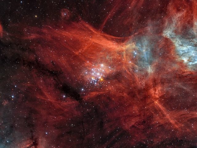 NGC 3293, often referred to as the Gem Cluster, is a spectacular bright open star cluster located in the constellation of Carina. In this narrowband bicolour image the delicate nebulosity across the entire background  really stands out.
It is one of the Southern Sky's finest binocular objects and consists of nearly one hundred stars huddled together in a tight group, with a contrasting bright red supergiant near it's centre - similar in appearance to Kappa Crucis in the Jewel Box Cluster.
Floating against a colourful backdrop of Milky Way stars and red Hydrogen emission, the cluster is also surrounded by a delicate faint blue haze visible in broadband images. 
The cluster was discovered by Abbé Nicolas Louis de La Caille in 1752 during his expedition to the Cape of Good Hope in South Africa.

Image details: 
Date: April - May 2022
Exposure: H-Alpha OIII: 405:540 mins, total 15 hours 45 mins @ -25C
Telescope: Homebuilt 12.5&quot; f/4 Serrurier Truss Newtonian
Camera: QSI 683wsg with Lodestar guider
Filters: Astrodon 3nm Ha OIII
Taken from my observatory in Auckland, New Zealand 