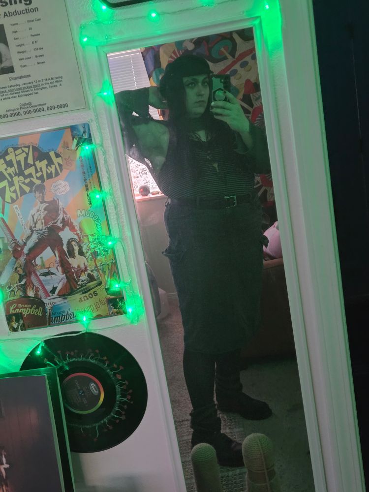 A shot in her mirror, the green lights illuminated her