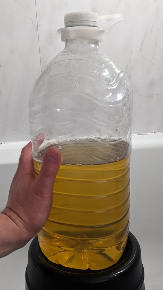 A bottle containing approximately 3 litres of my own cold piss, collected throughout the day yesterday.