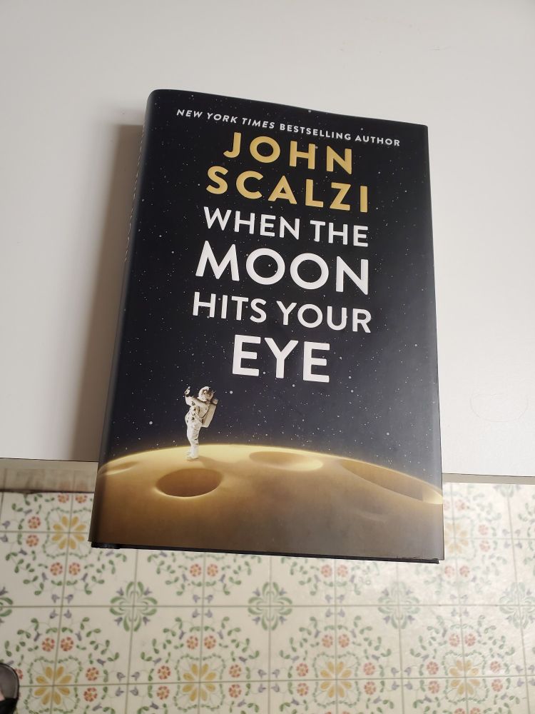Brand-new copy of John Scalzi's book, "When the Moon Hits Your Eye." He signed it for us tonight at BookPeople in Austin. 