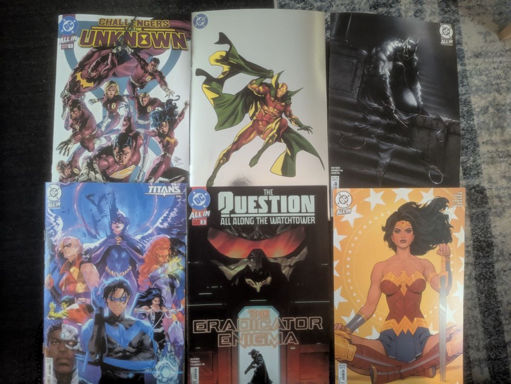 Comic books: Challengers Unknown #1, New Gods #1 with Mister Miracle on the cover, Absolute Batman #3 variant cover, Titans #18, The Question All Along The Watchtower #2, Wonder Woman #16