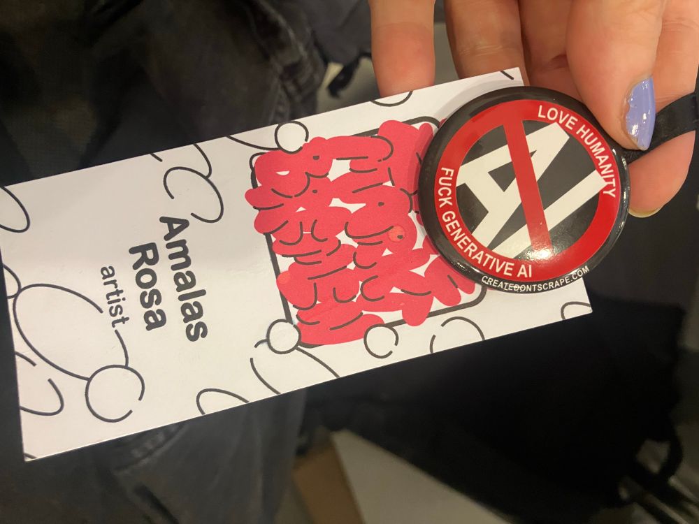 Photo of my festival batch with my name and an anti ai button 