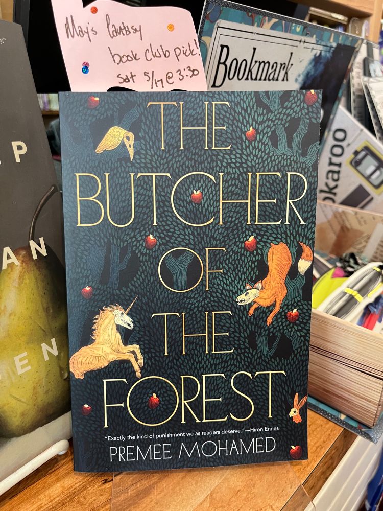 A copy of Premee Mohamed's "The Butcher of the Forest" with a bookmark noting that it's May's fantasy book club pick at the Bookseller in Grass Valley, CA