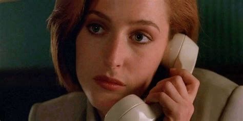 A close up of Scully from X-Files. She’s on the phone and looking contemplative. 
