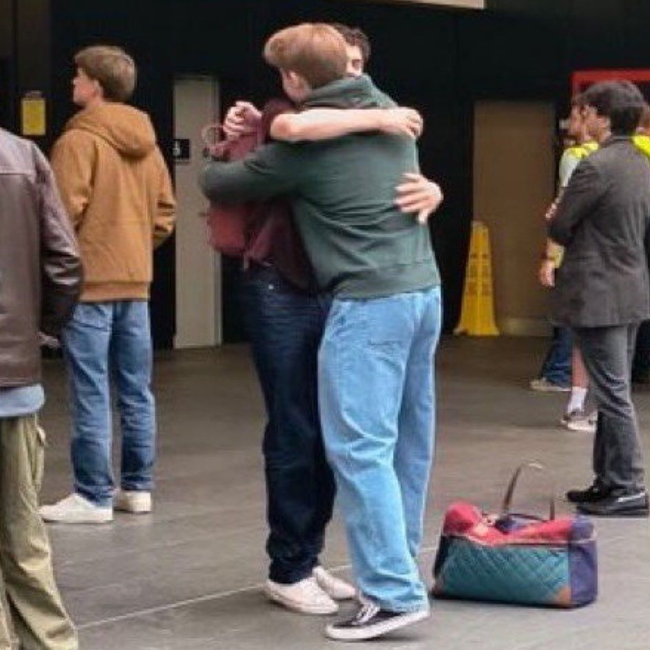 Nick and Charlie hugging in a shot from the shooting of the heartstopper movie