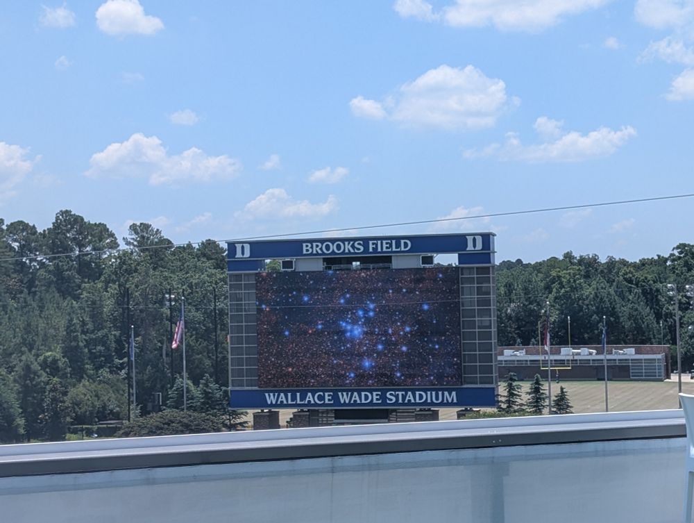 Image of a nebula from Rubin Observatory displayed on a scoreboard at Brooks Field, Wallace Wade stadium, Duke University 