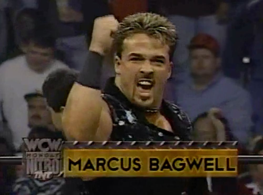 Marcus Alexander Bagwell, fist pumped in triumph, hair INSANELY nineteen ninety five.