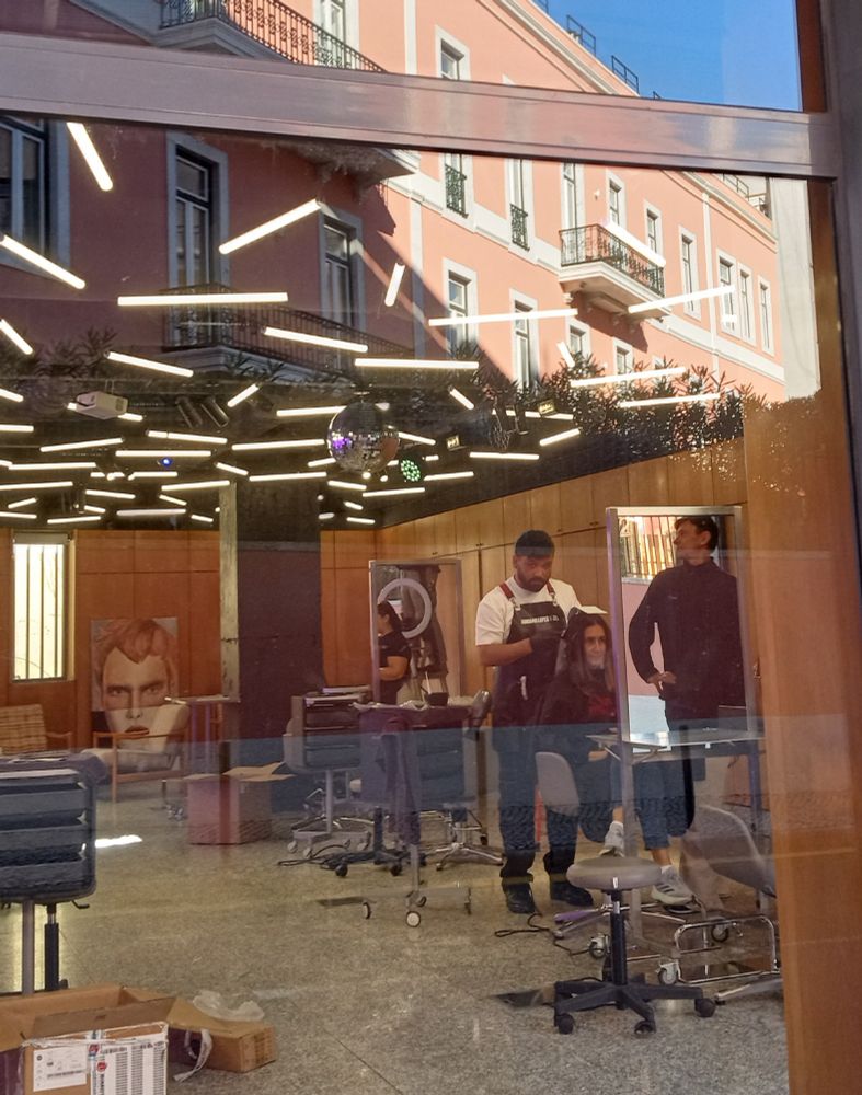 Image of Lisboa hair design school where they're putting up disco lights today.