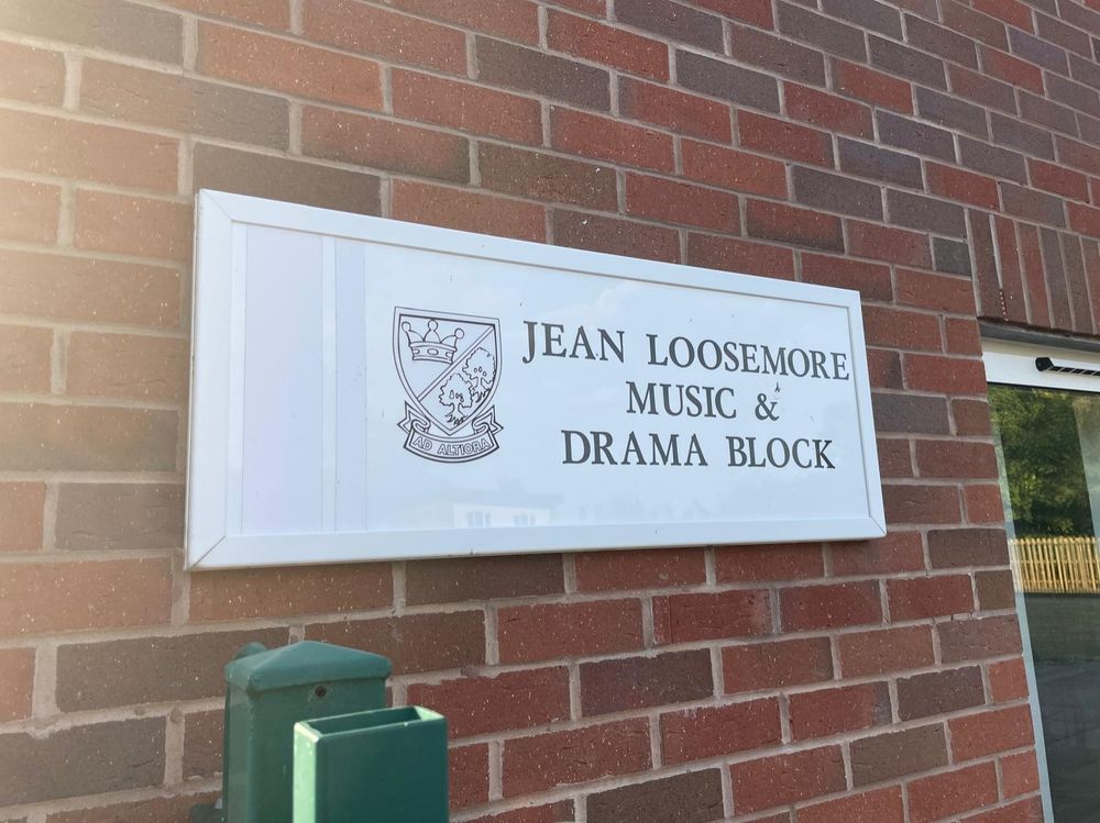 School building name sign saying "Jean Loosemore Music & Drama Block"