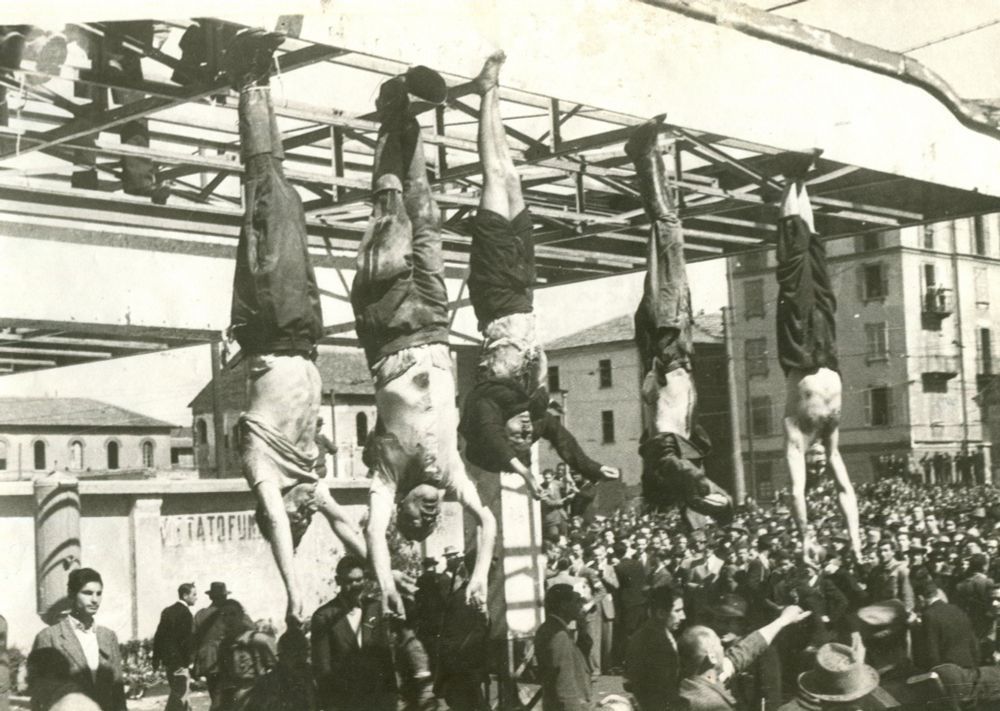 Mussolini and his family being hung by their feet outside the main railway station in Milan, 1945, after being executed by Italian Partisans