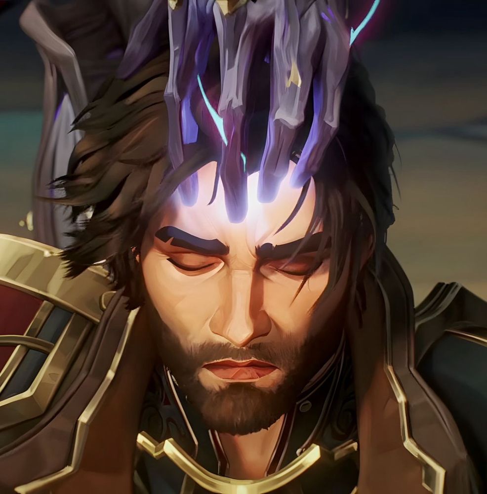 Screenshot of Jayce Talis from season 2, episode 9, of Arcane. His eyes are closed and he is kneeling with his head slightly angled downwards. He appears almost at peace, if somewhat resigned.

The four fingers of the Arcane Herald's left hand are resting lightly on Jayce's forehead, with a small amount of white Arcane light emanating from them.
