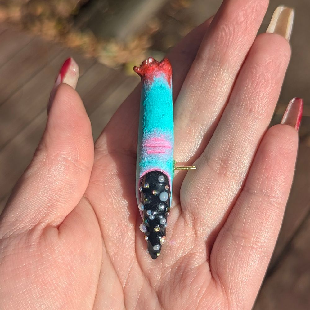 A top view of the pin showing off the nail