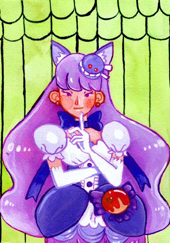 Cure Macaron in front of a green background arms crossed