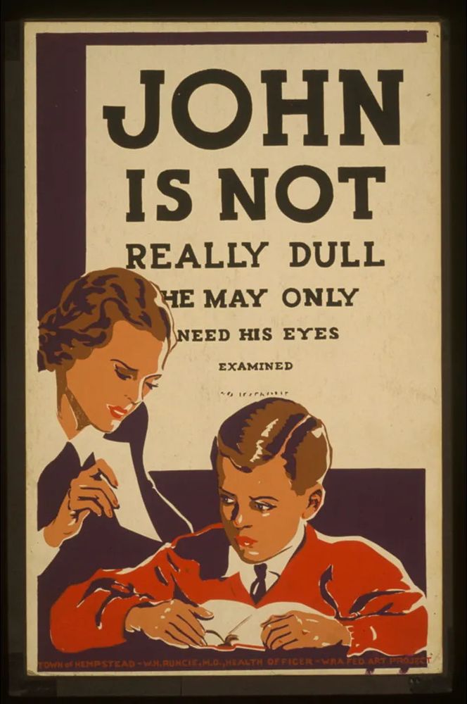 A poster with a teacher and a boy with the text, "John is not really dull he  may only need his eyes examined"