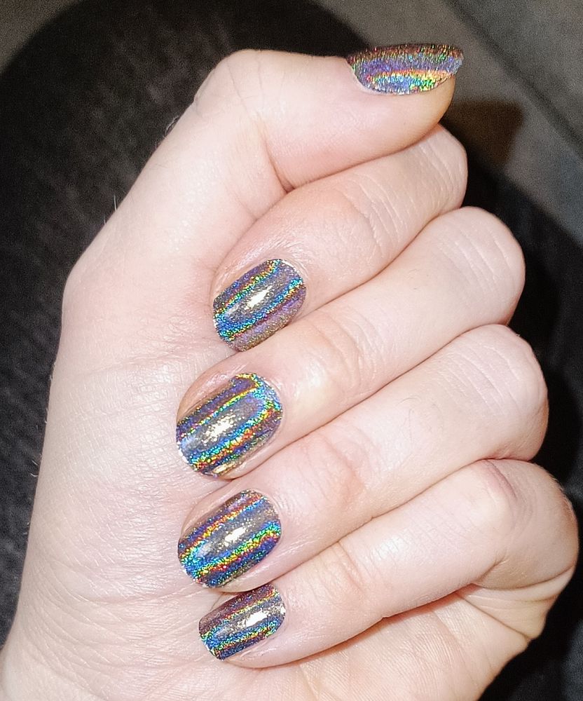 Bild meiner zusammengelegten Hand mit den glitzernden Nägeln