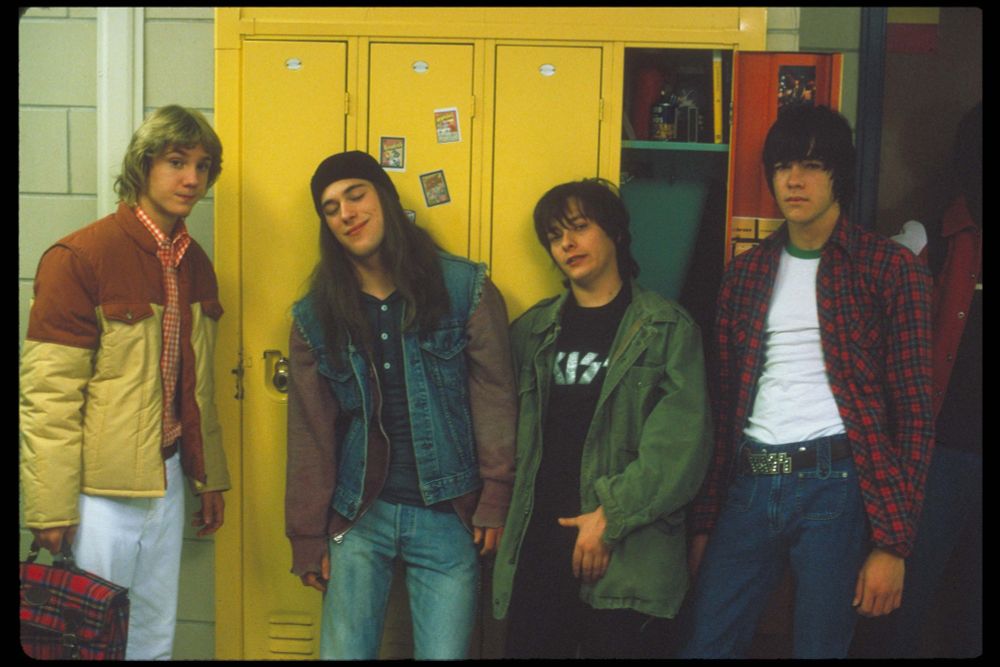 picture from the film DETROIT ROCK CITY, showing the four protagonists leaning against a series of school lockers, one of which is open. 
