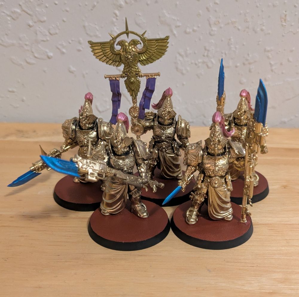 5 Custodian Wardens, minimally painted so that they look to be made of pure living gold, like the Oscar statue guy.